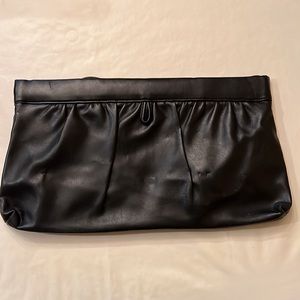 Clutch in black bag, very gently used